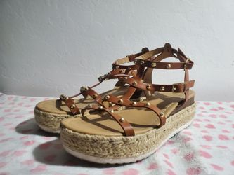 Tan Sandles with Brown Straps and Gold Accents