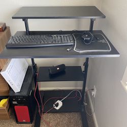Height adjustable computer desk