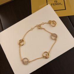 Fendi Gold Tone Logo Bracelet with Crystal Embellishments