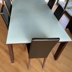 Glass top dining room table for 6
