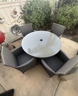 Patio table and 4  chairs brand new