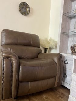 brown single reclining and rocking chair