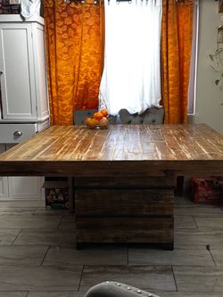 Large dining room table with bench and chairs
