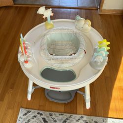 SKIP / HOP ACTIVITY CENTER. IT CAN BE TURN INTO A KIDS ACTIVITY TABLE AS WELL . THE SEAT TURNS 360 DEGREES SO BABY CAN LOOK AROUND THE  ROOM. $50.00 