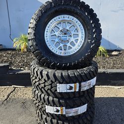 17" KMC rims w/ 35x12.50R17 Toyo MT Open Country tires