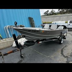 Aluminum body fishing boat with mercury 18 engine.