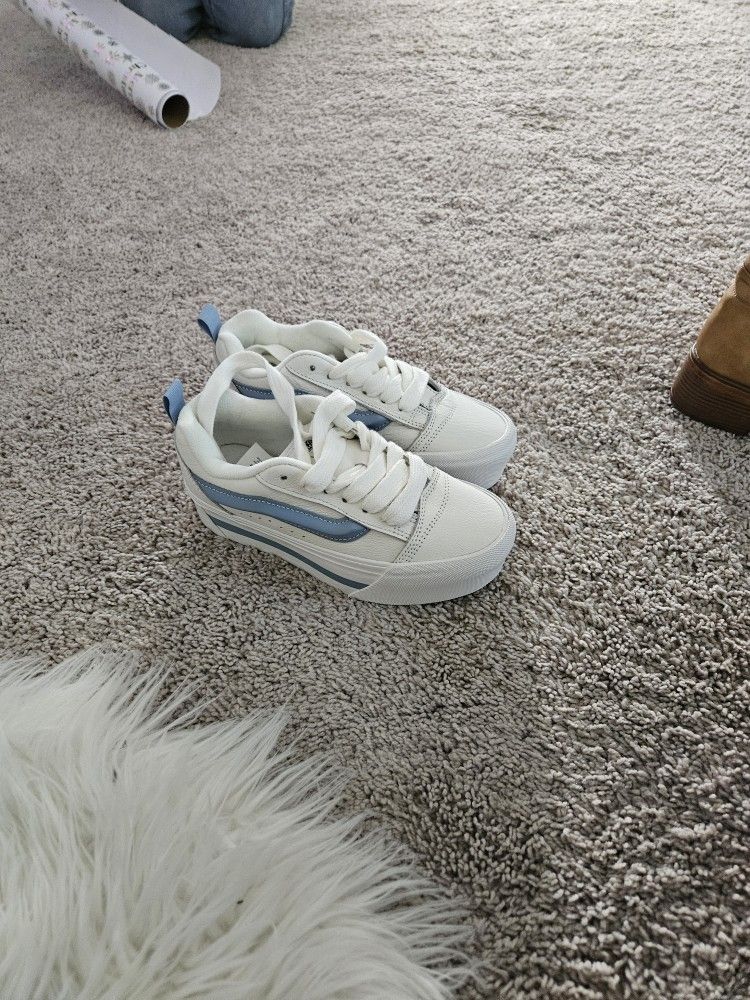 blue and white tall vans