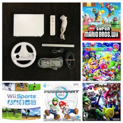 NINTENDO WII with Mario Kart,Mario party, Mario bros. Smash Bros. Wii Sports