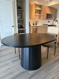 Open box 55 inch oval dining table (has a dent)
