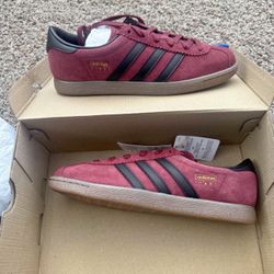 Woman’s burgundy Adidas 