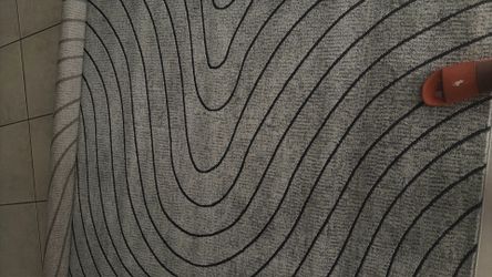 Stylish Serena 8071A rug. Has a gray color with wavy lines pattern. Size is 5 feet by 7 feet. Made in