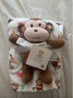 White and brown baby blanket with cute monkey design #babyessentials