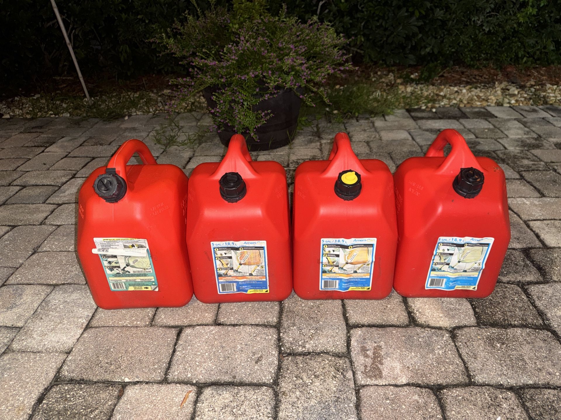 four 5gal gas cans