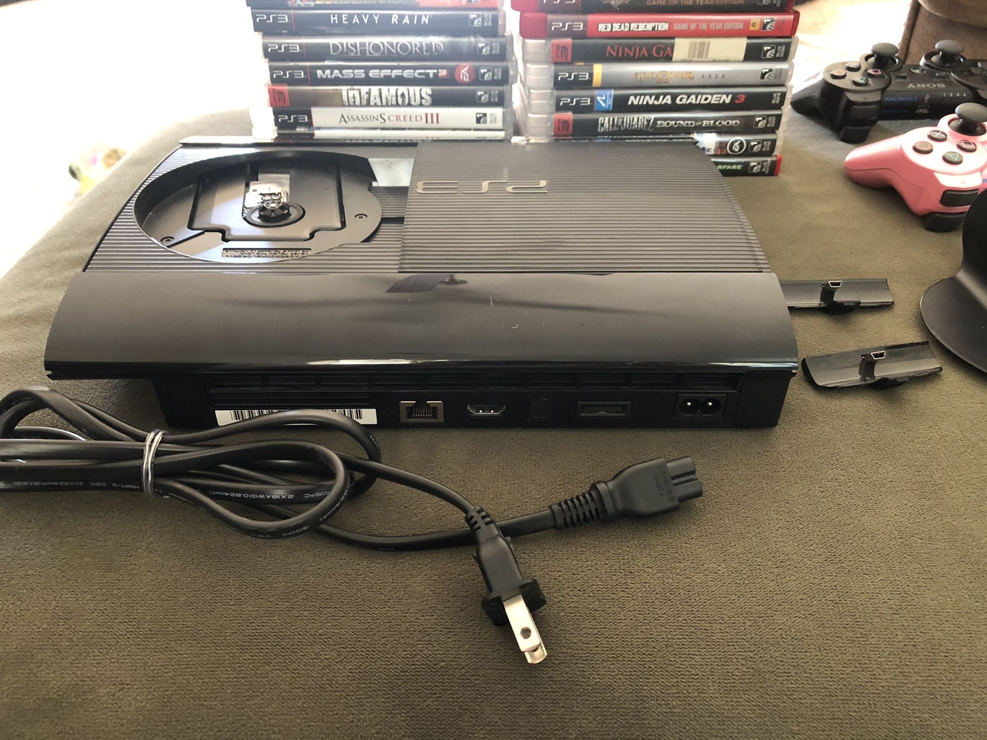 PS3, 2 controllers, 17 games, and a charging station