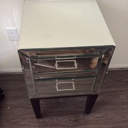 two mirrored side tables both for $100