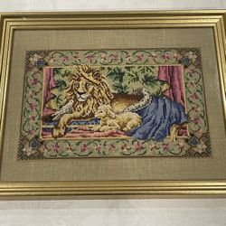 Framed "Peace on Earth" cross-stitch featuring a lion and lamb. 15.5”x 12.5” Including Frame