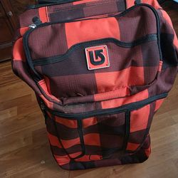 Burton wheelie luggage. Plaid grunge, red. Barely used/like new.