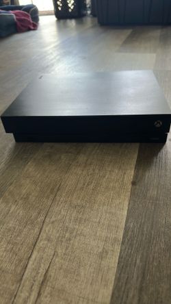 Xbox one X console with four games
