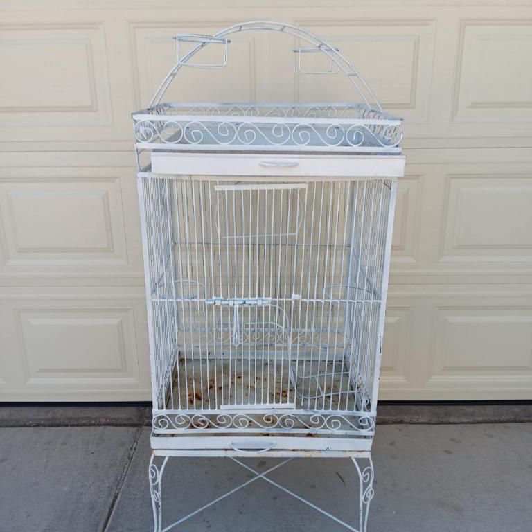  large metal bird cage  Height 50"  Width 24"  Depth 20"  White bird cage.  Pick up only near Tropicana and jones