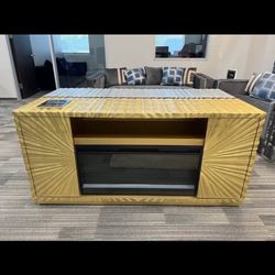 Gold-colored TV console, new in box