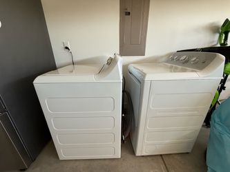 GE energy star 4.4 cu. Ft. Stainless steel capacity washer and  7.2 cu. Ft. Dryer