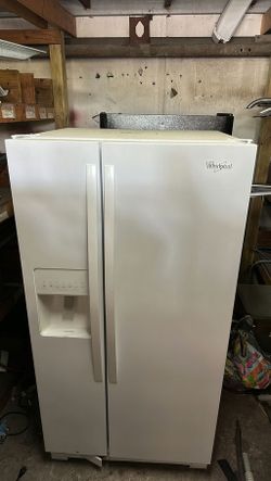 White Whirlpool Refrigerator with Water Dispenser