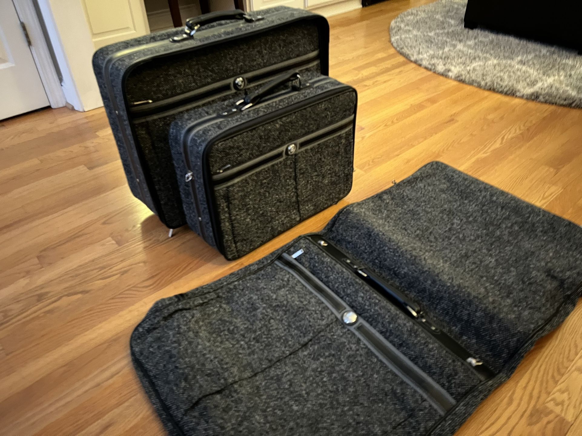 Three-piece new DoorDash luggage set and one preowned roller bag overhead size