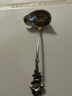 vintage Reed & Barton cream or sauce ladle from the "Harlequin" series, featuring the "Wild Rose" pattern.  Material: It is available in both sterling