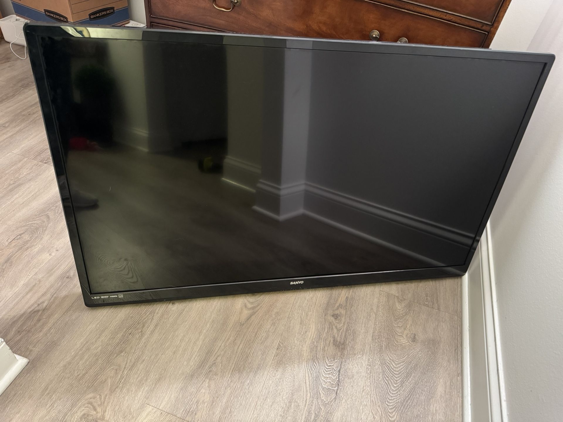 A Sanyo 50 Inch TV w/ Stand And Wall Mount