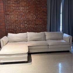 Beige Sofa. Brand: Kaczmarek L-Shaped Sofas With Movable Ottoman From Wayfair