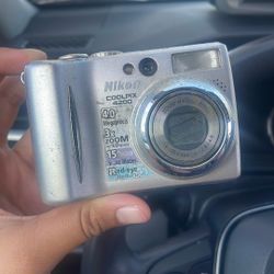 Nikon (working) *needs a battery & memory card