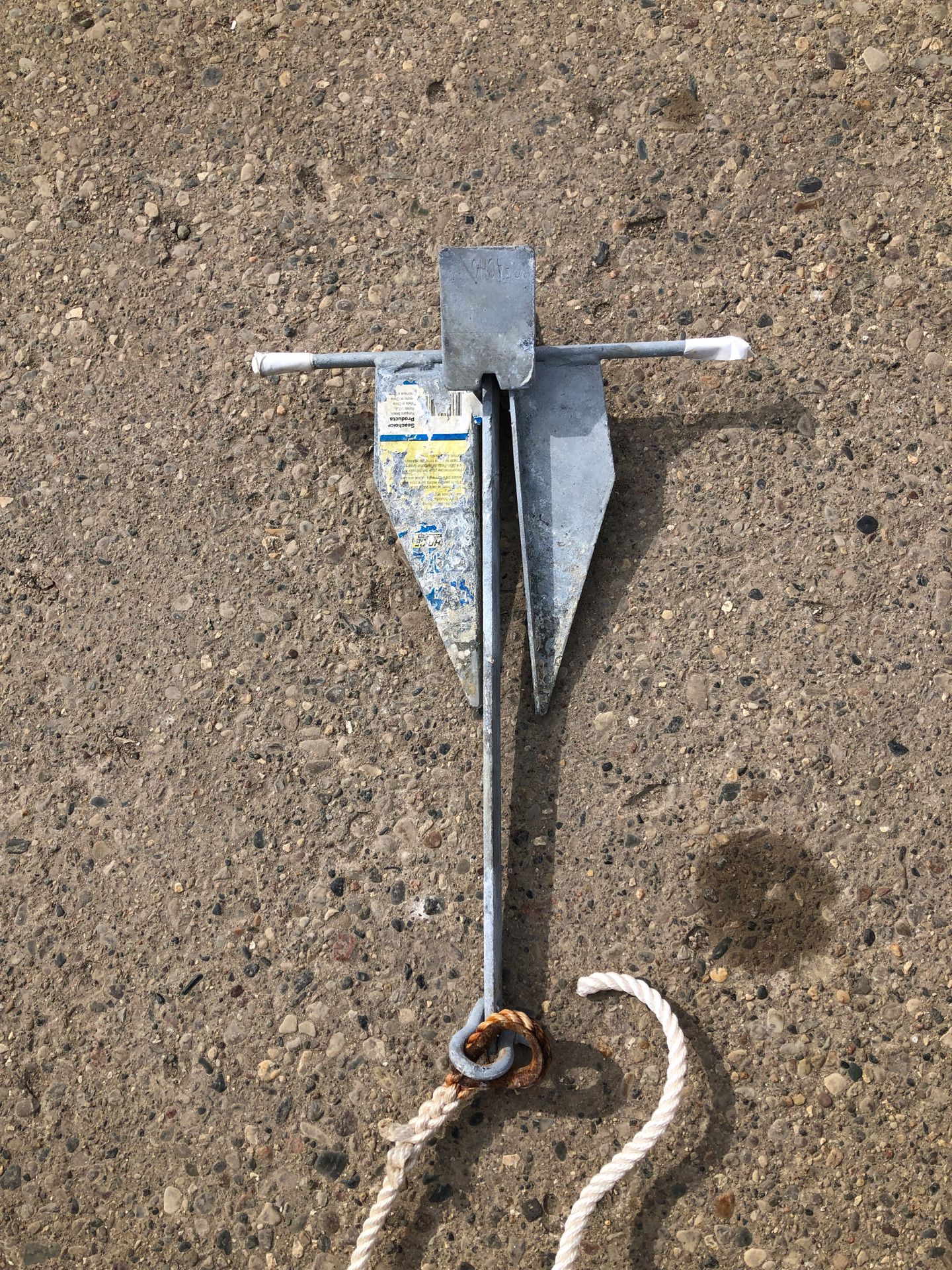 Small galvanized anchor with line