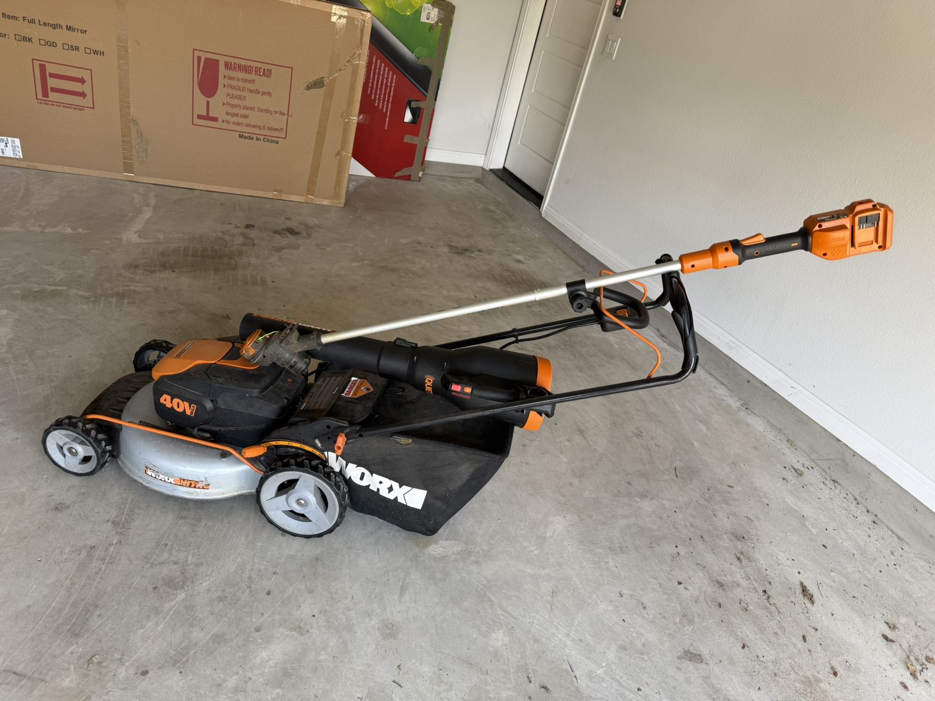 Battery Powered Mower, blower, Weed Eater, And Battery Charger + 1 Battery.