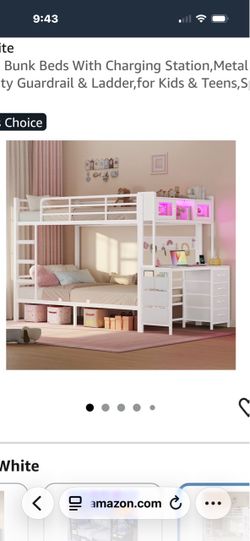 White metal bunk bed with attached desk