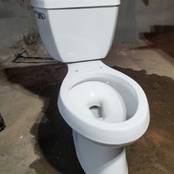 Unused KOHLER toilet W a Service Kit Of New Parts