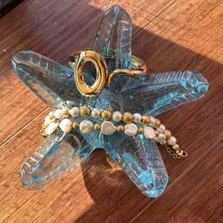 Gold plates bangle and 2 pearl and gold bracelets.