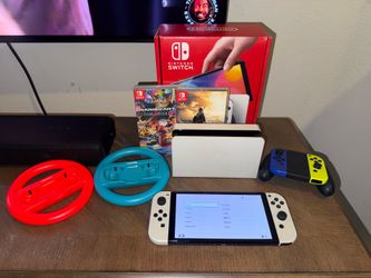 Nintendo Switch OLED with box, accessories and games. Firm price