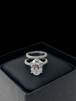 Oval diamond platinum ring with matching band