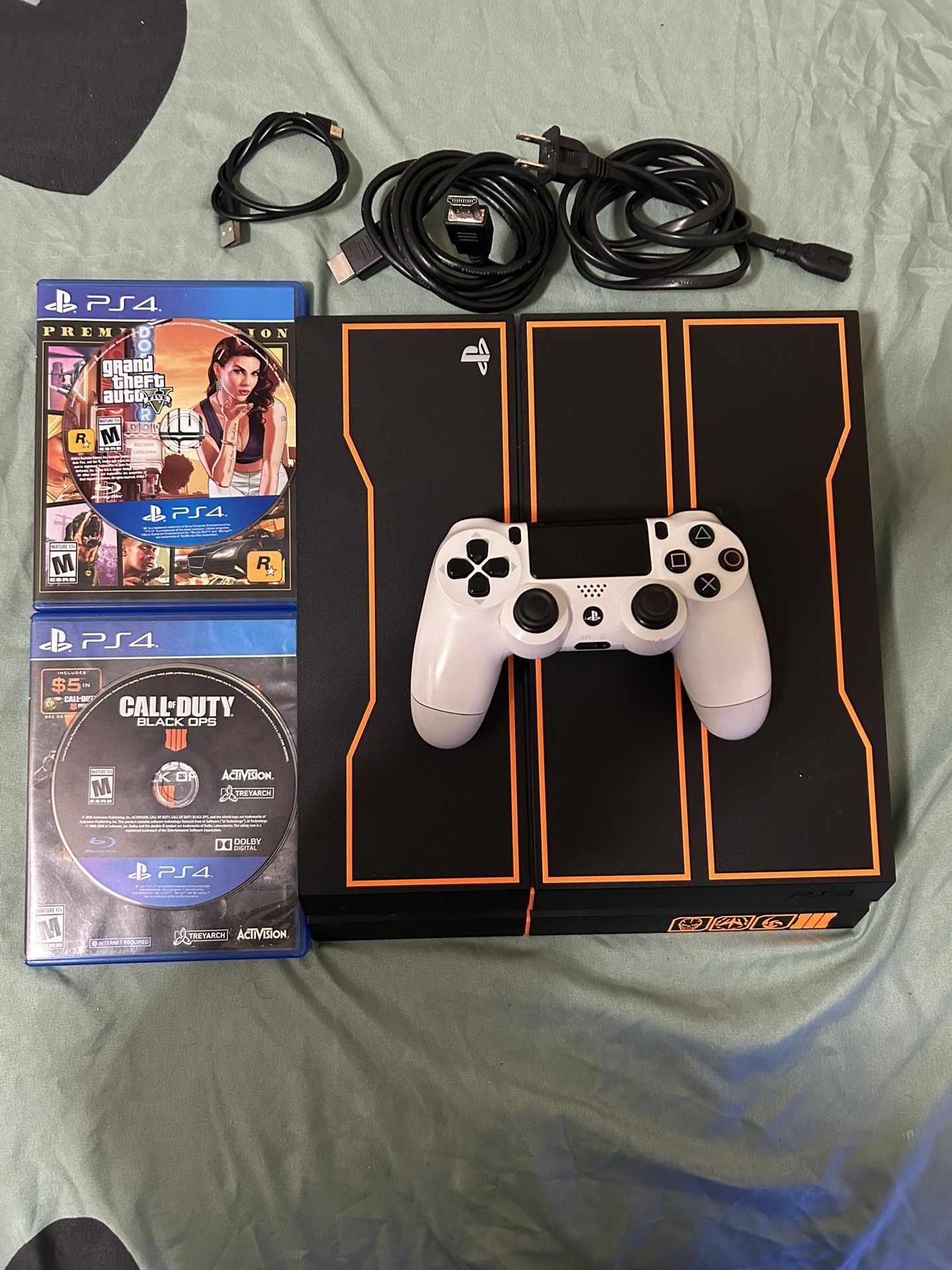 PS4 (playstation 4 call of duty black opps edition) with one controller all the cables including controller charger, 2 games GTA 5 and black opps 4