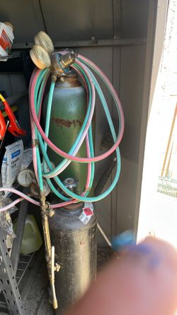 Welding tanks with gauges and cutting torch