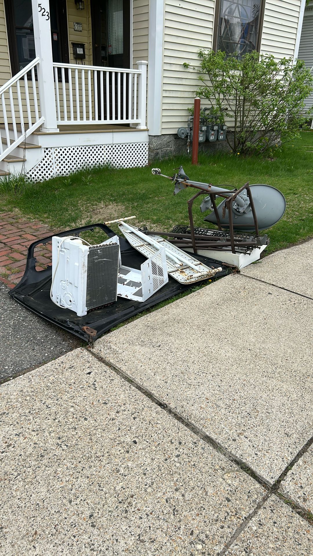 Scrap Metal On Sidewalk