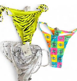 Vibrant swimwear bikini bottom from Forever 21. Includes neon yellow with black stripes, colorful eye pattern, and black and white snake print designs
