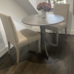 Gray wood accent table with 2 chairs from Crate and Barrel