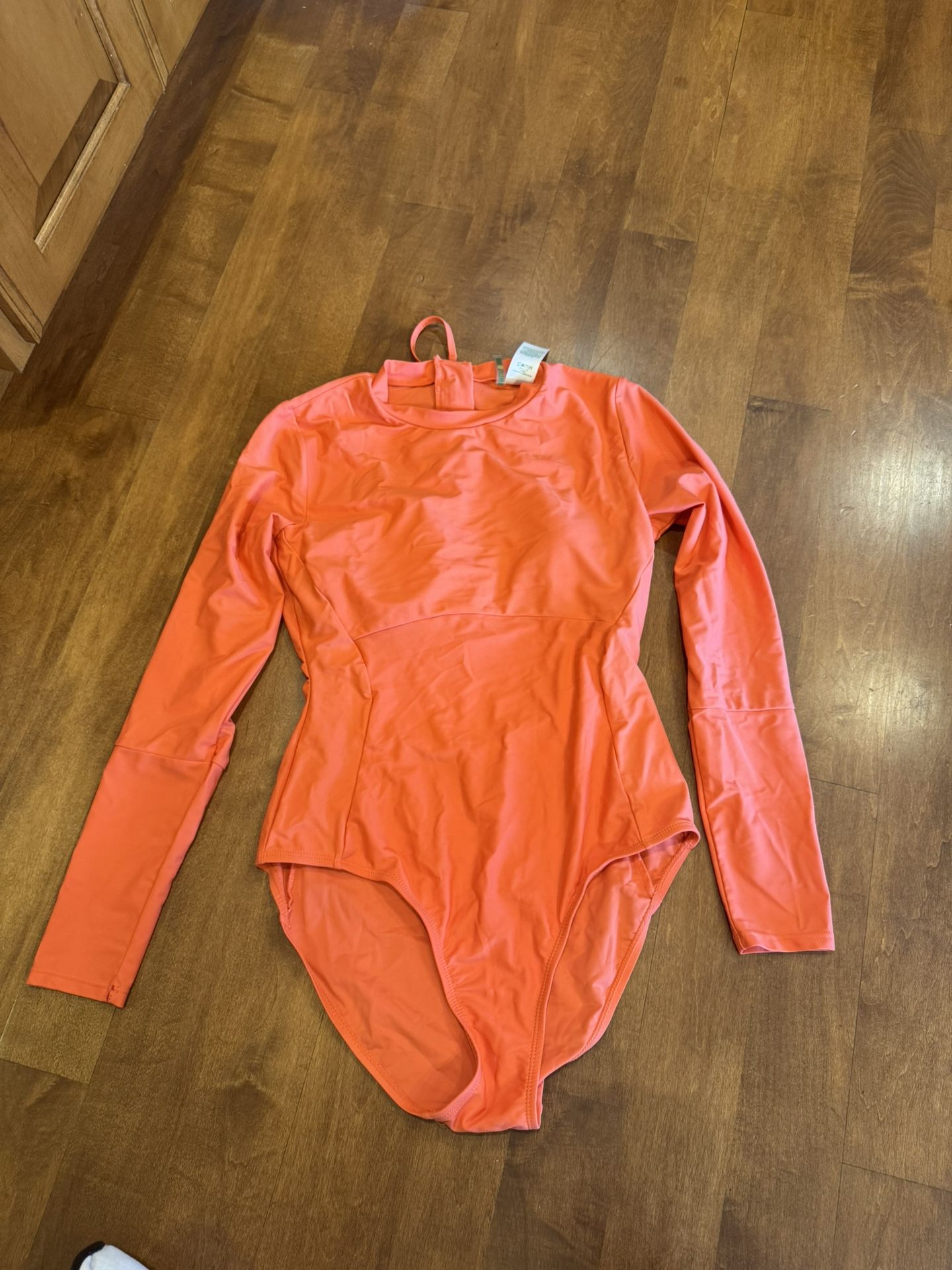 Woman’s Sandflower One Piece Long Sleeve Swimsuit Shipping Available