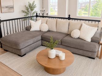 Large gray sectional couch with left chaise and throw pillows