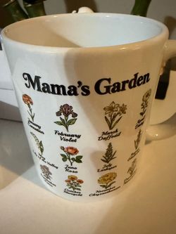 Sweet ceramic mug has 'Mama's Garden' on it.