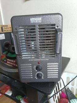 Floor heater with safety button