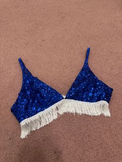 Sparkling blue sequin bralette with playful sequin white fringe along the hem. Adjustable straps for a comfortable fit. Lightweight and designed for s