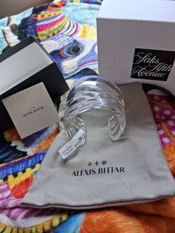It's by Alexis  Bittar..clear in color