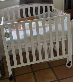 Foldable White Mini Baby Crib with Wheels